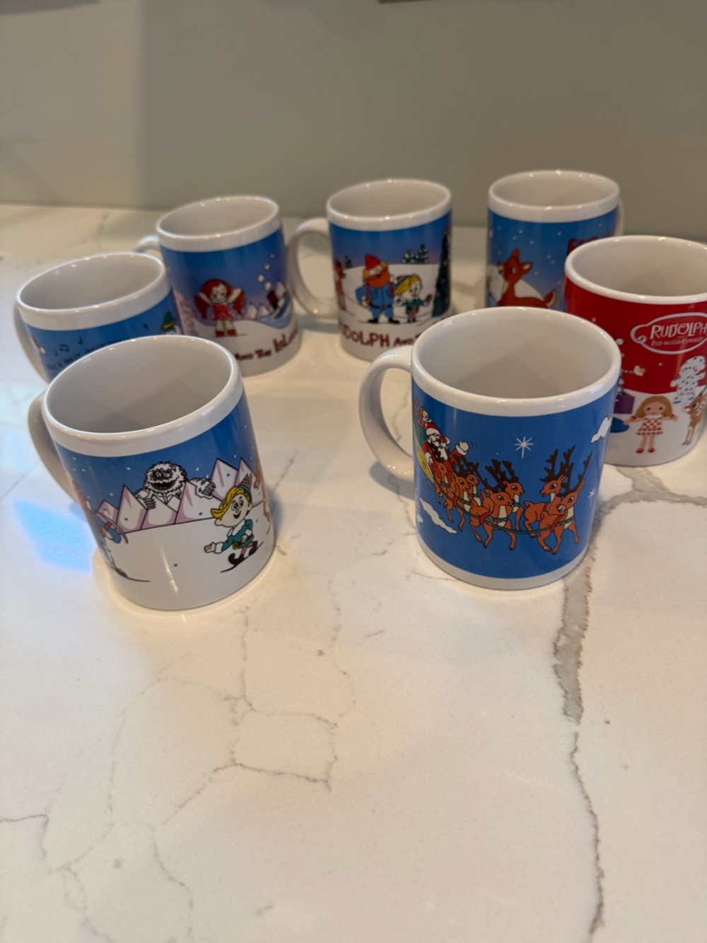 Complete set of 6 1998-1999 CVS Rudolph the Red Nose Reindeer holiday mugs.